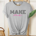 Gray t-shirt with 'MAKE me' text on a hanger