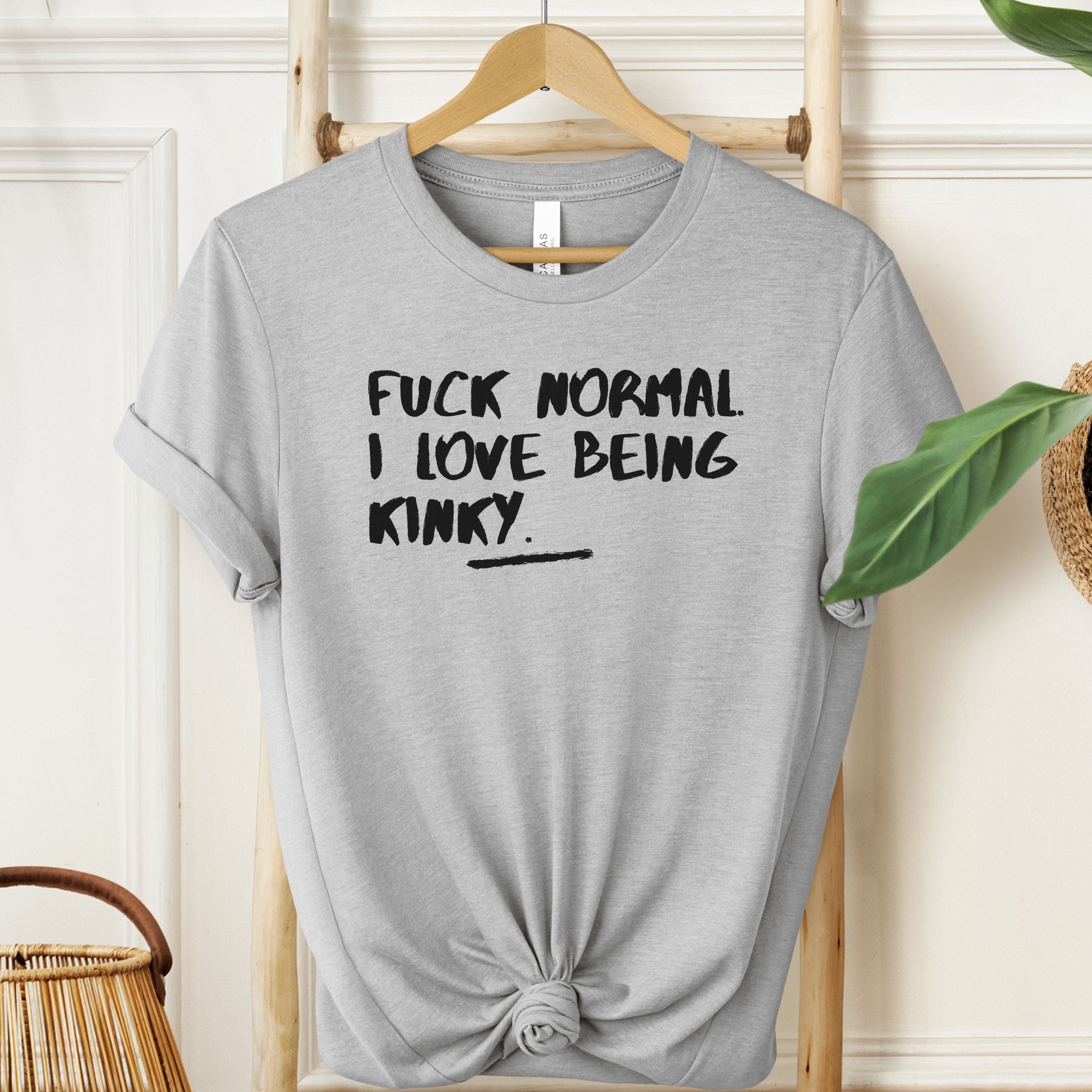 Athletic Heather T-shirt with “Fuck Normal I Love Being Kinky” bold text design.