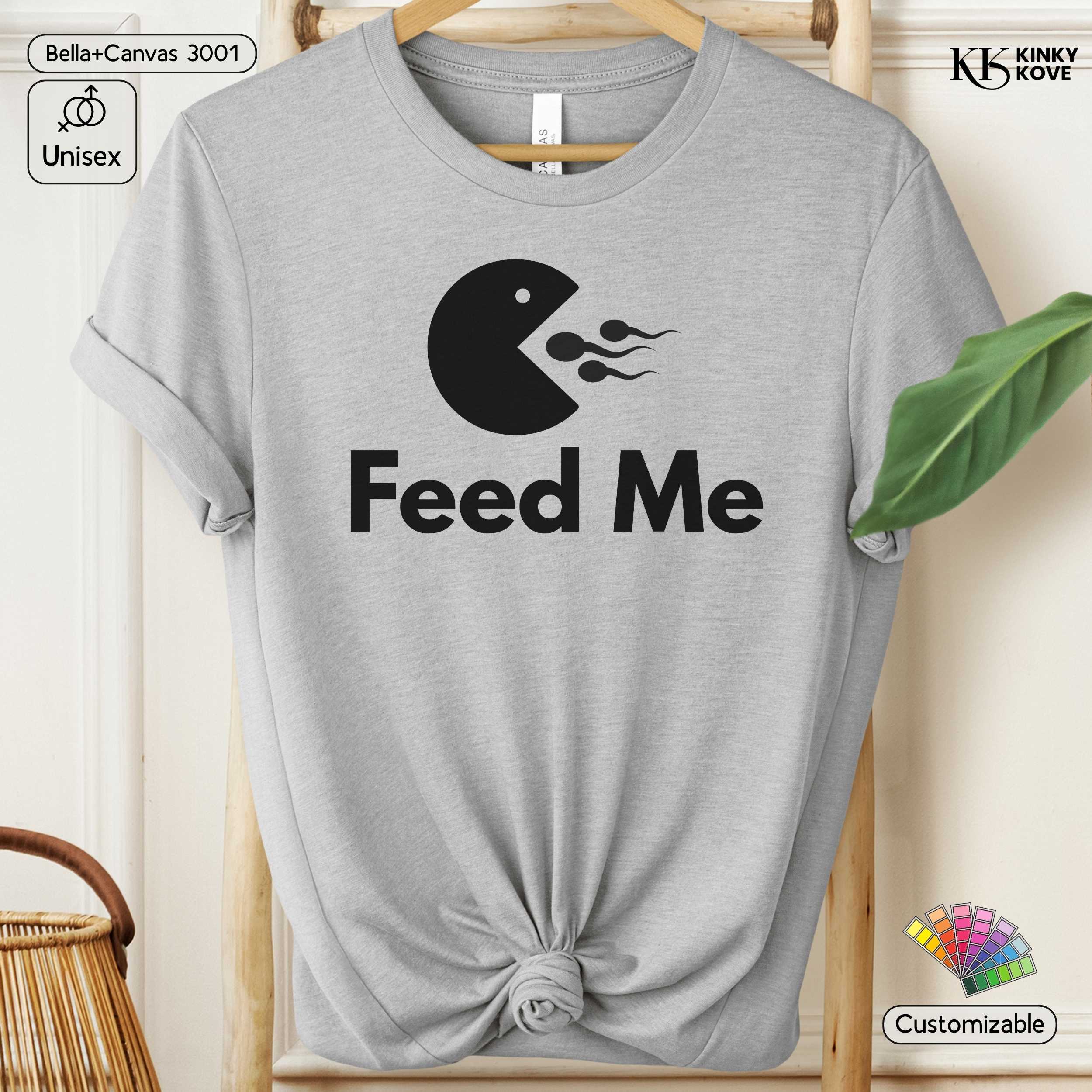 Gray t-shirt with 'Feed Me' graphic design on a hanger
