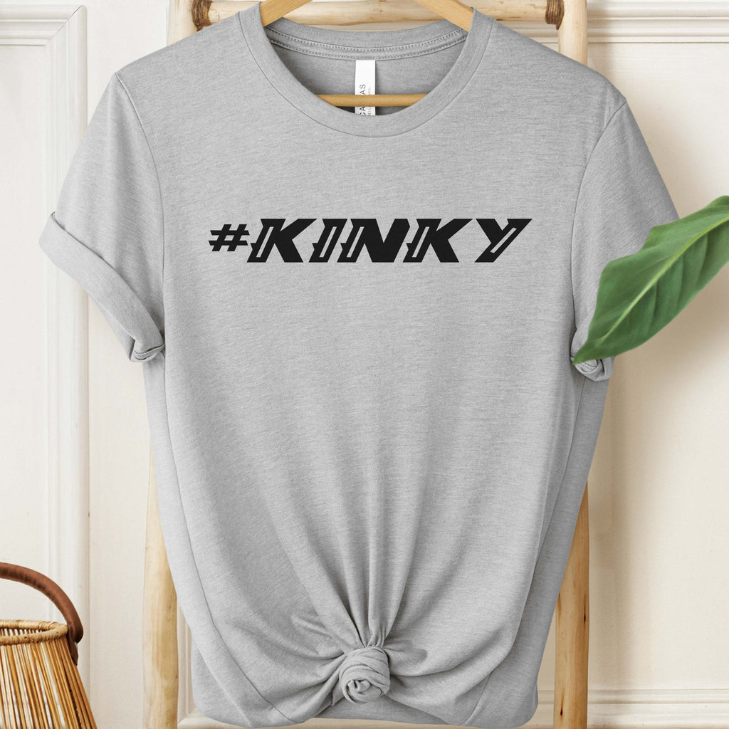 Gray t-shirt with '#KINKY' text on a hanger against a neutral background