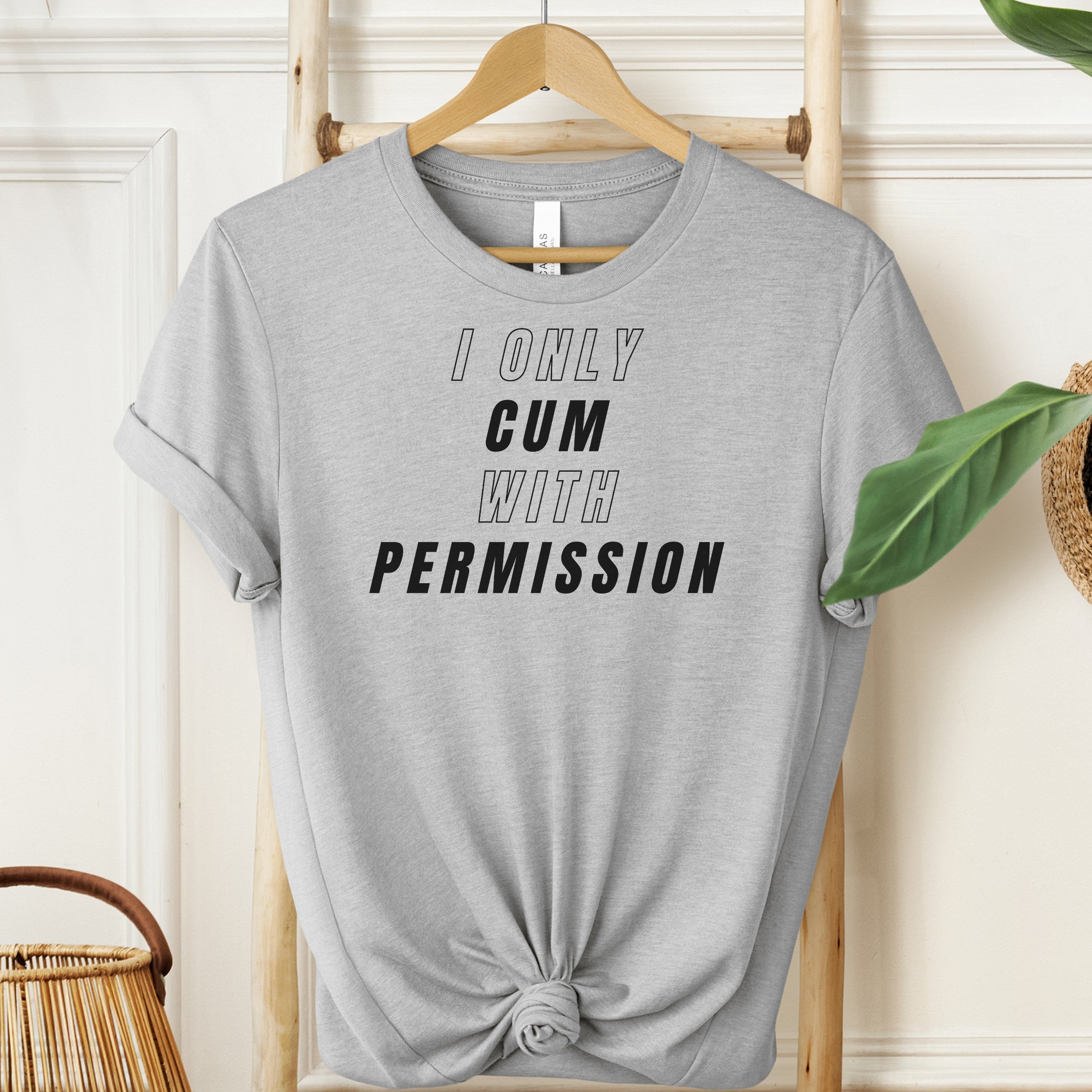 Gray t-shirt with text 'I ONLY CUM WITH PERMISSION' on a hanger.