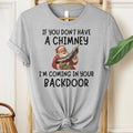 Gray t-shirt with Santa Claus graphic and humorous text on a hanger.