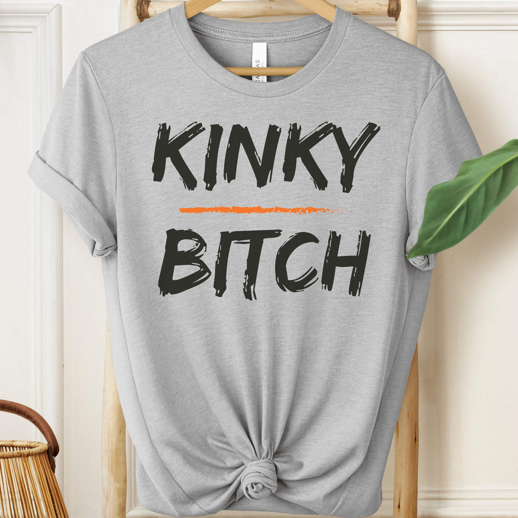 Gray t-shirt with 'KINKY BITCH' text on a hanger.