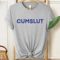 Gray t-shirt with 'CUMSLUT' printed in blue on a hanger.