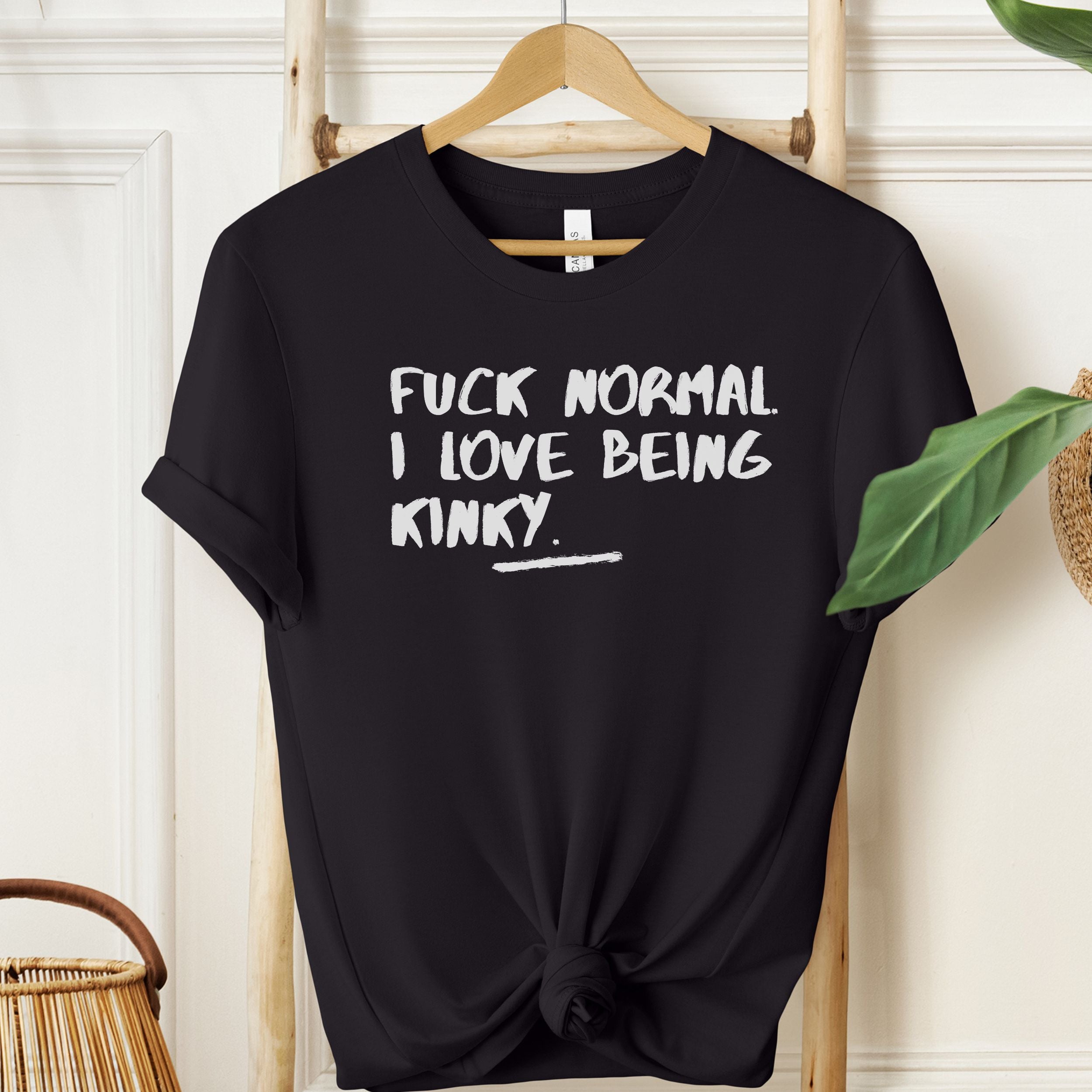 Black T-shirt with white “Fuck Normal I Love Being Kinky” statement text.