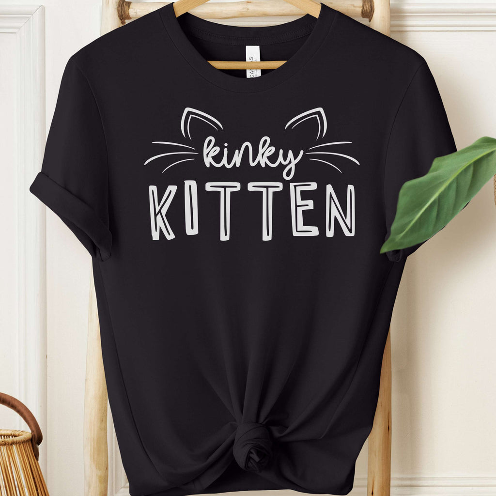 Black t-shirt with 'kinky KITTEN' text and cat ears design on a hanger.