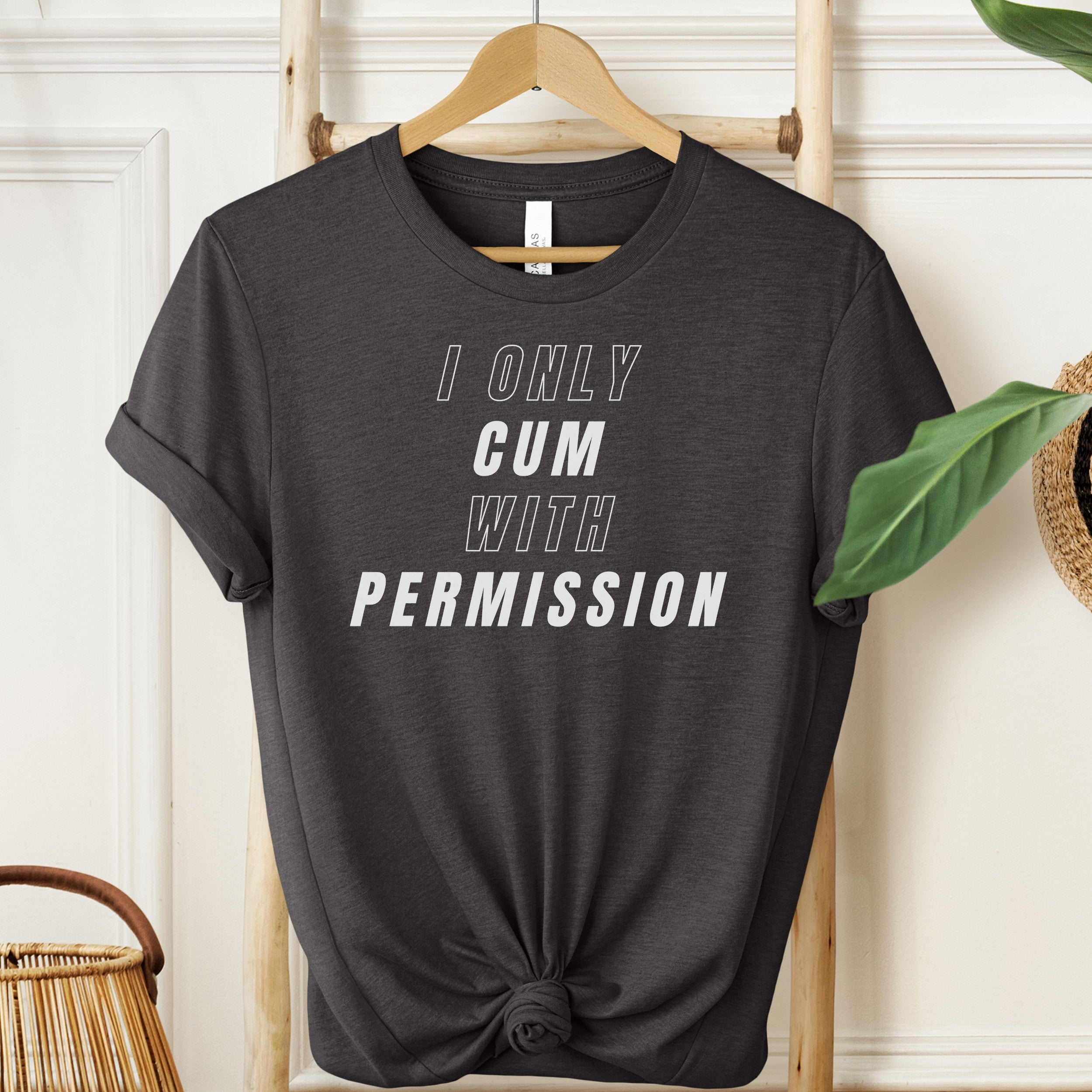 Black t-shirt with 'I Only Cum with Permission' text on a hanger.