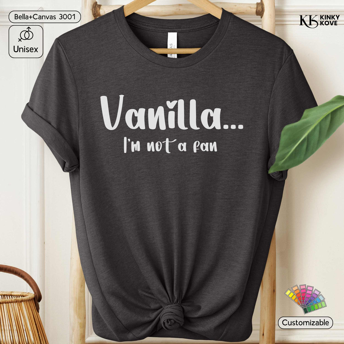 A dark charcoal gray t-shirt with rolled sleeves and a knotted hem, featuring the white text 'Vanilla.