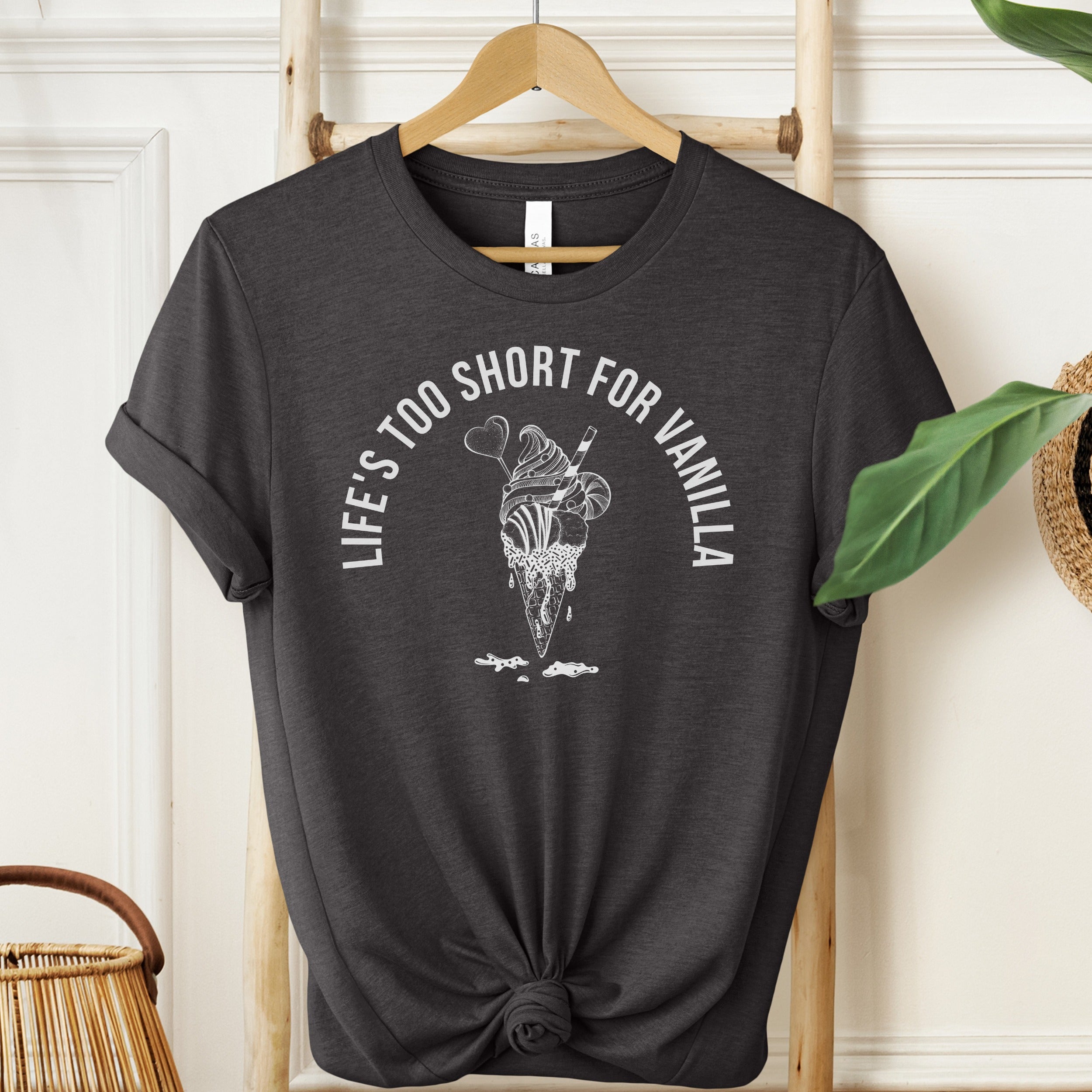 Black t-shirt with ice cream graphic and text 'Life's too short for vanilla' on a hanger.