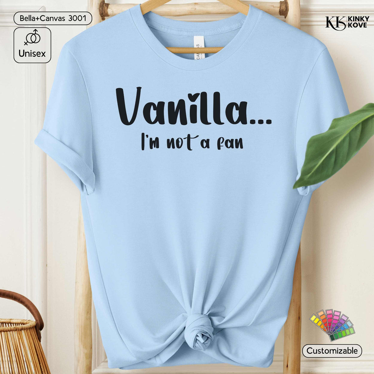 A light blue short-sleeve t-shirt with rolled cuffs and a knotted hem, featuring the text 'Vanilla.