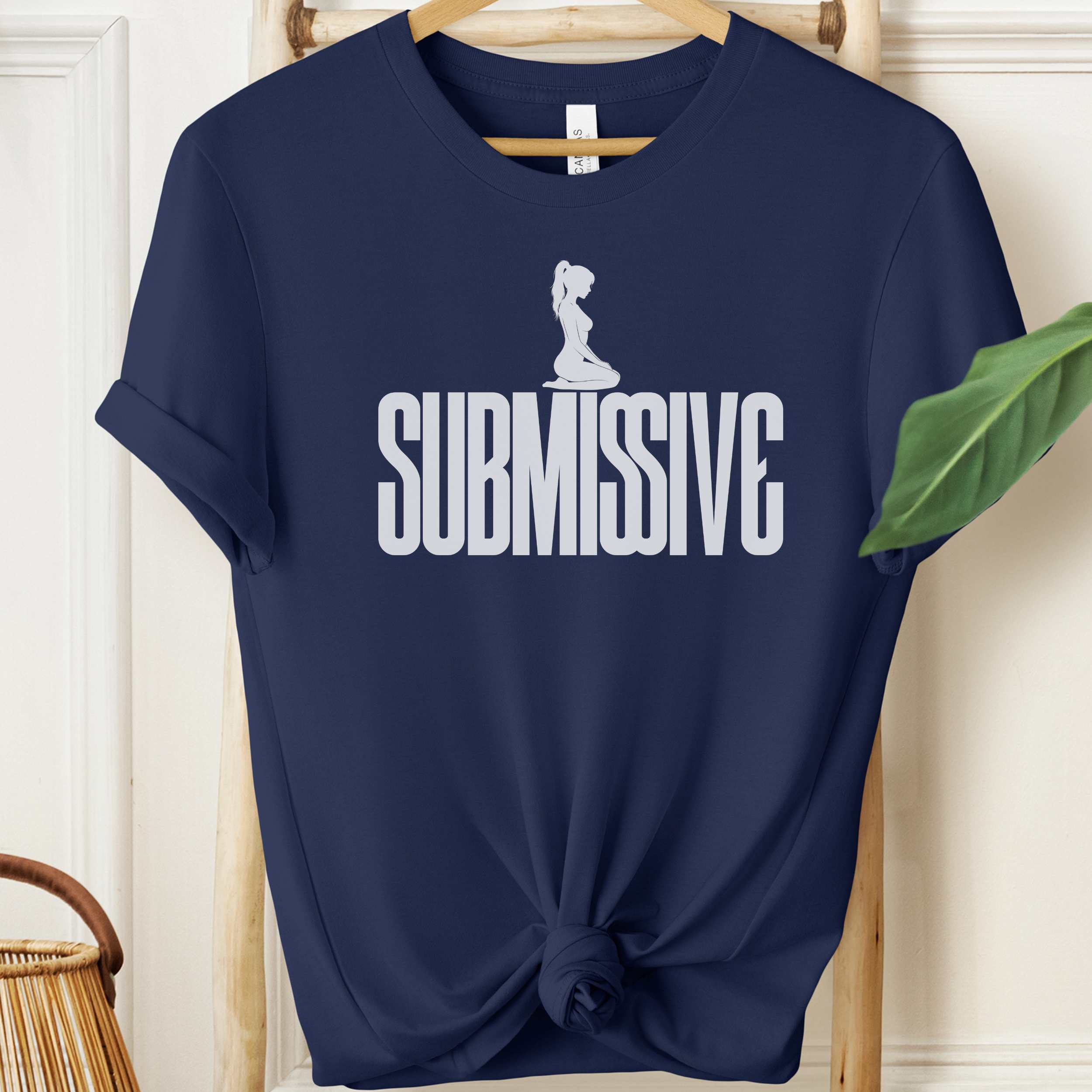 Navy blue t-shirt with 'SUBMISSIVE' text and graphic on a hanger.