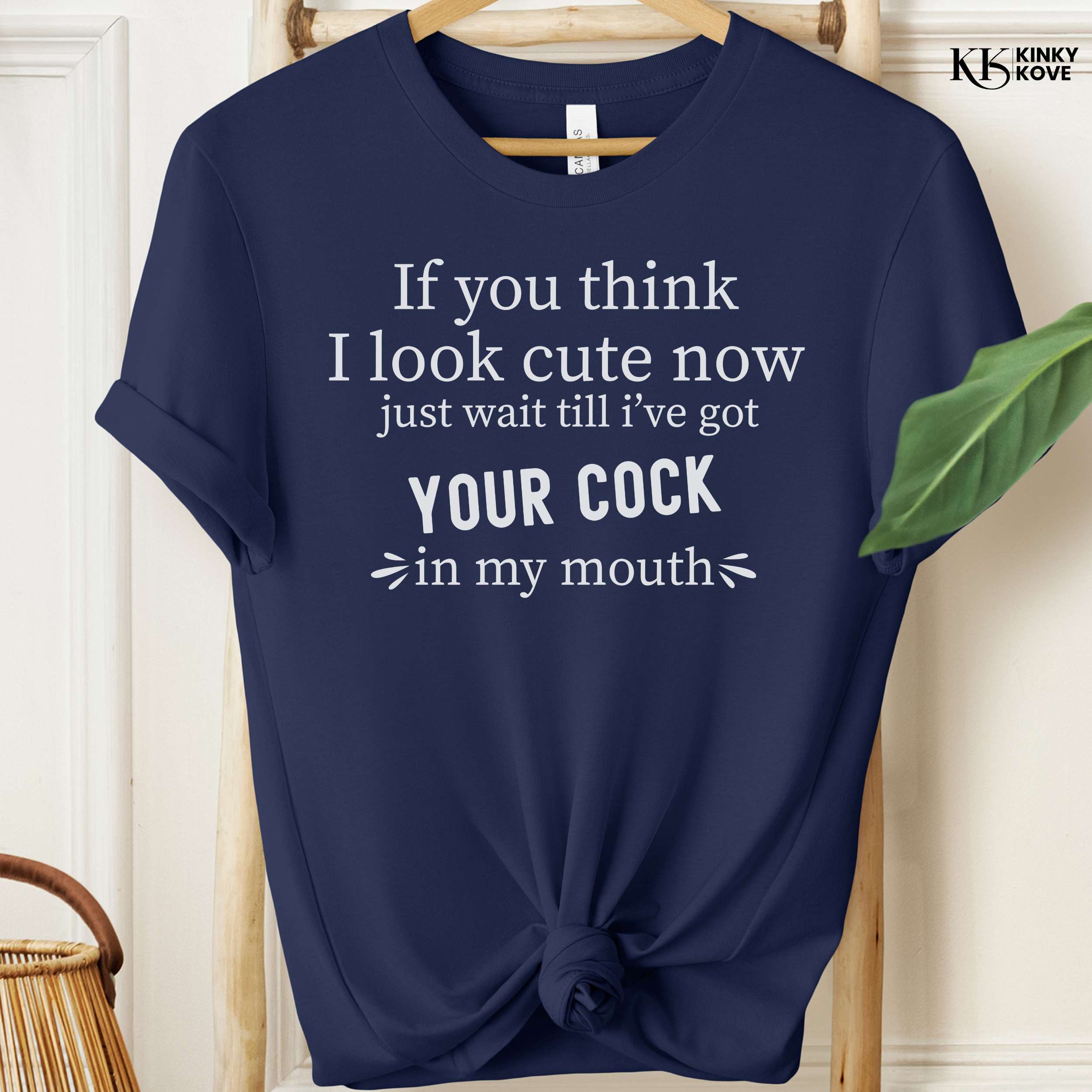 Navy blue t-shirt with white text on a hanger, brand 'Kinky Kove' visible.