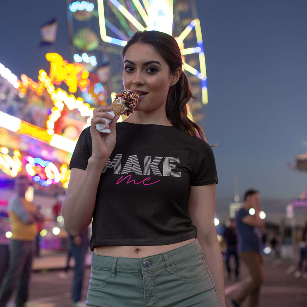 Woman eating ice cream at a carnival with colorful lights in the background