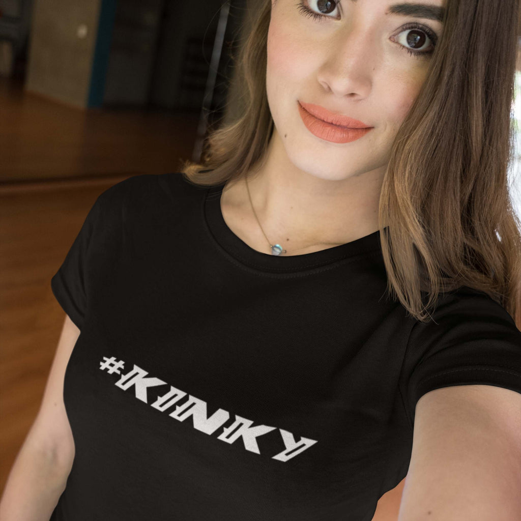 Person wearing a black t-shirt with '#KINKY' text.
