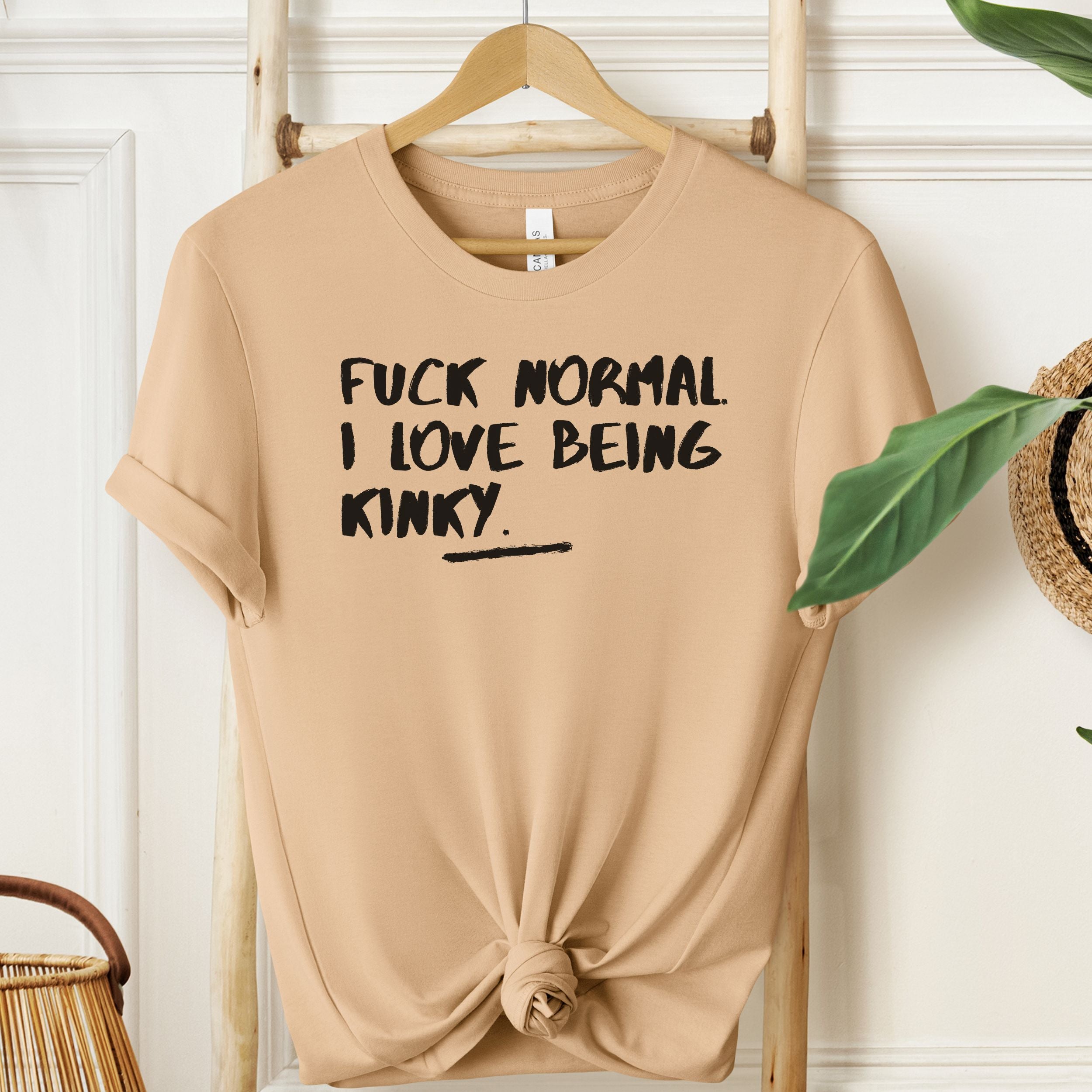 Sand Dune beige T-shirt with bold kinky quote in black.