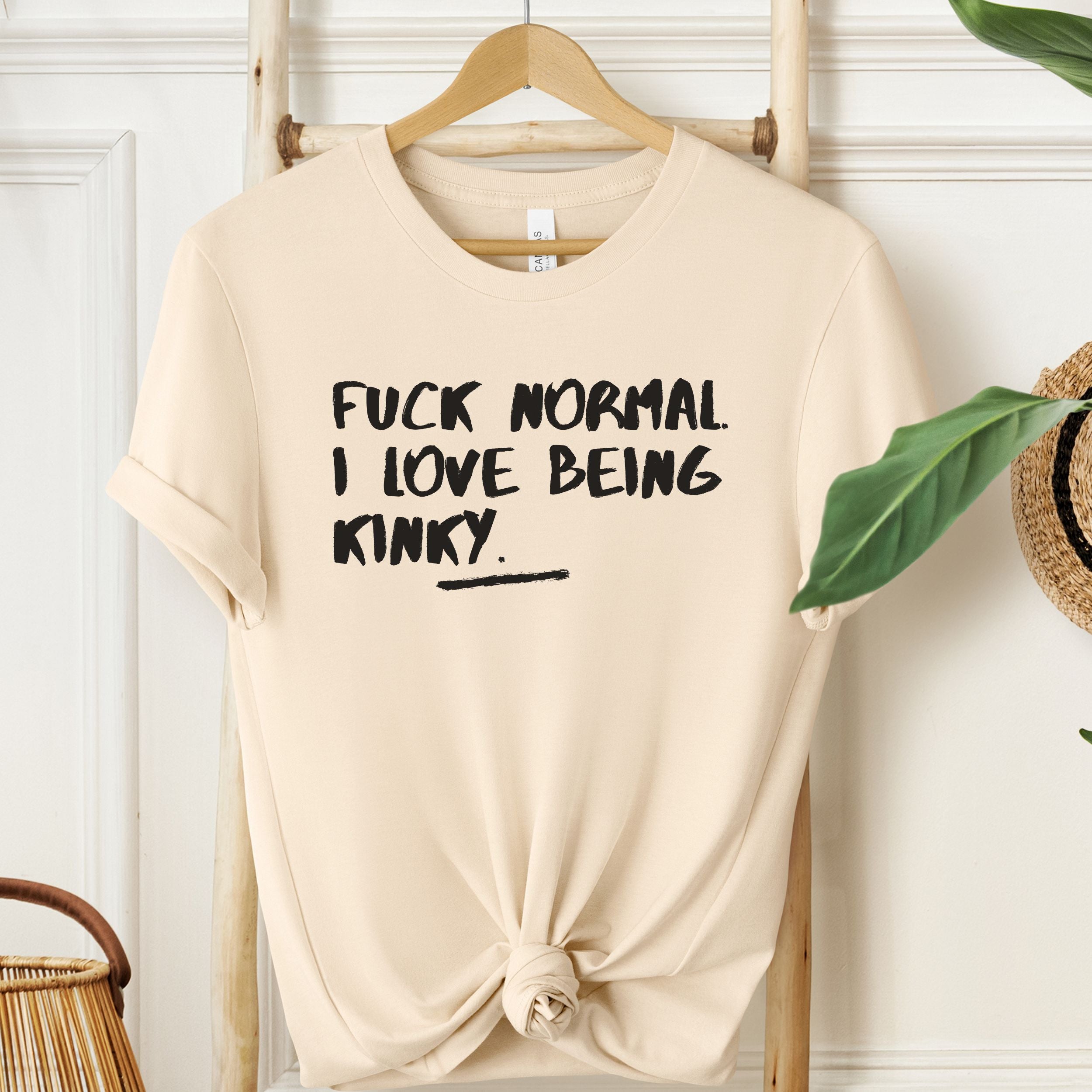 Soft Cream T-shirt with black kinky statement design.