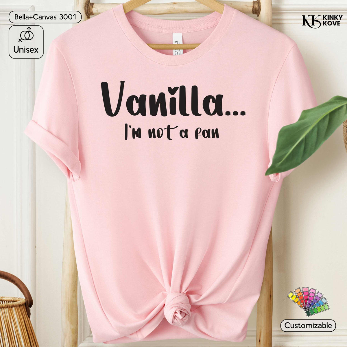 A light pink short-sleeve t-shirt with rolled sleeves and a knotted hem, featuring the black text 'Vanilla.