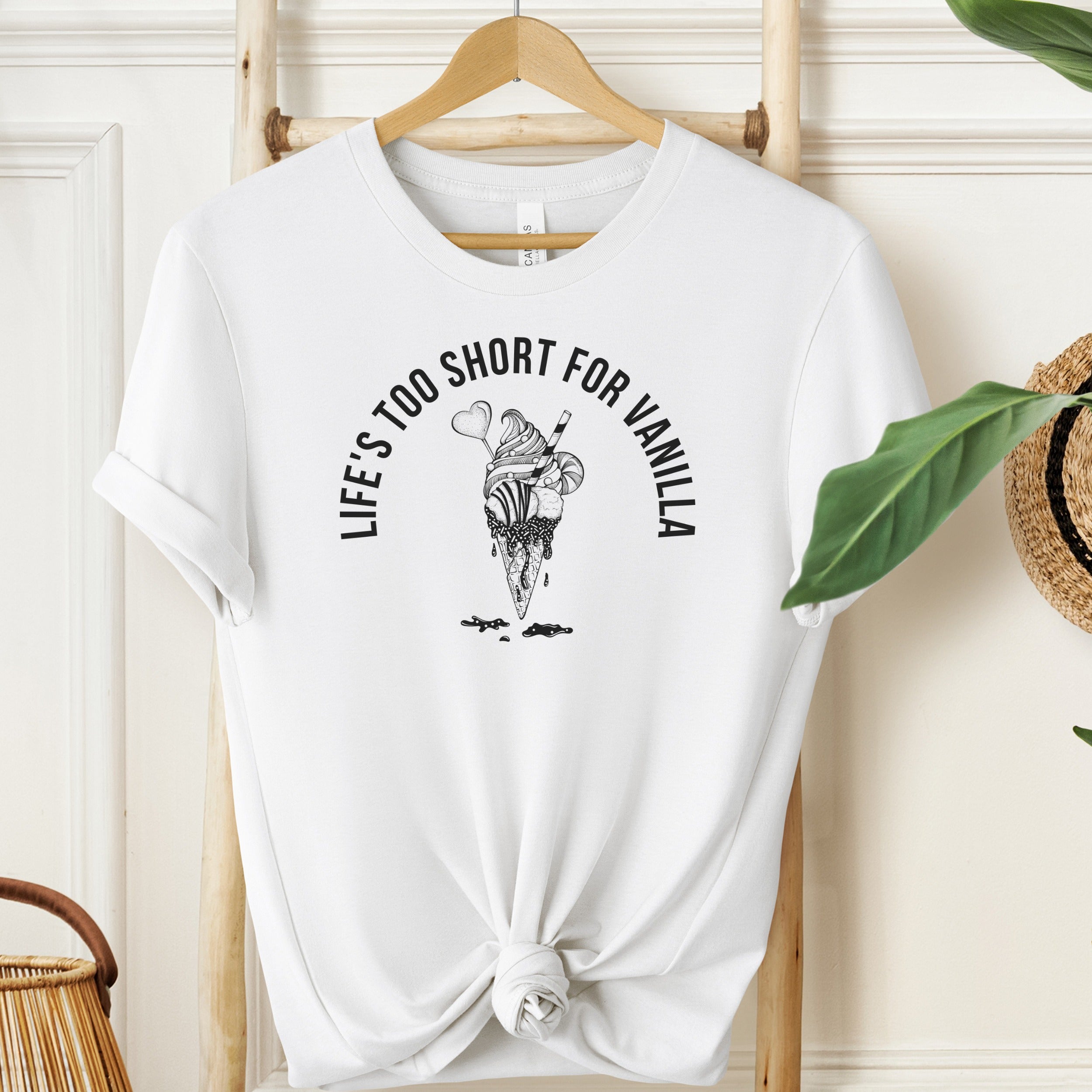 White t-shirt with ice cream graphic and text on a hanger