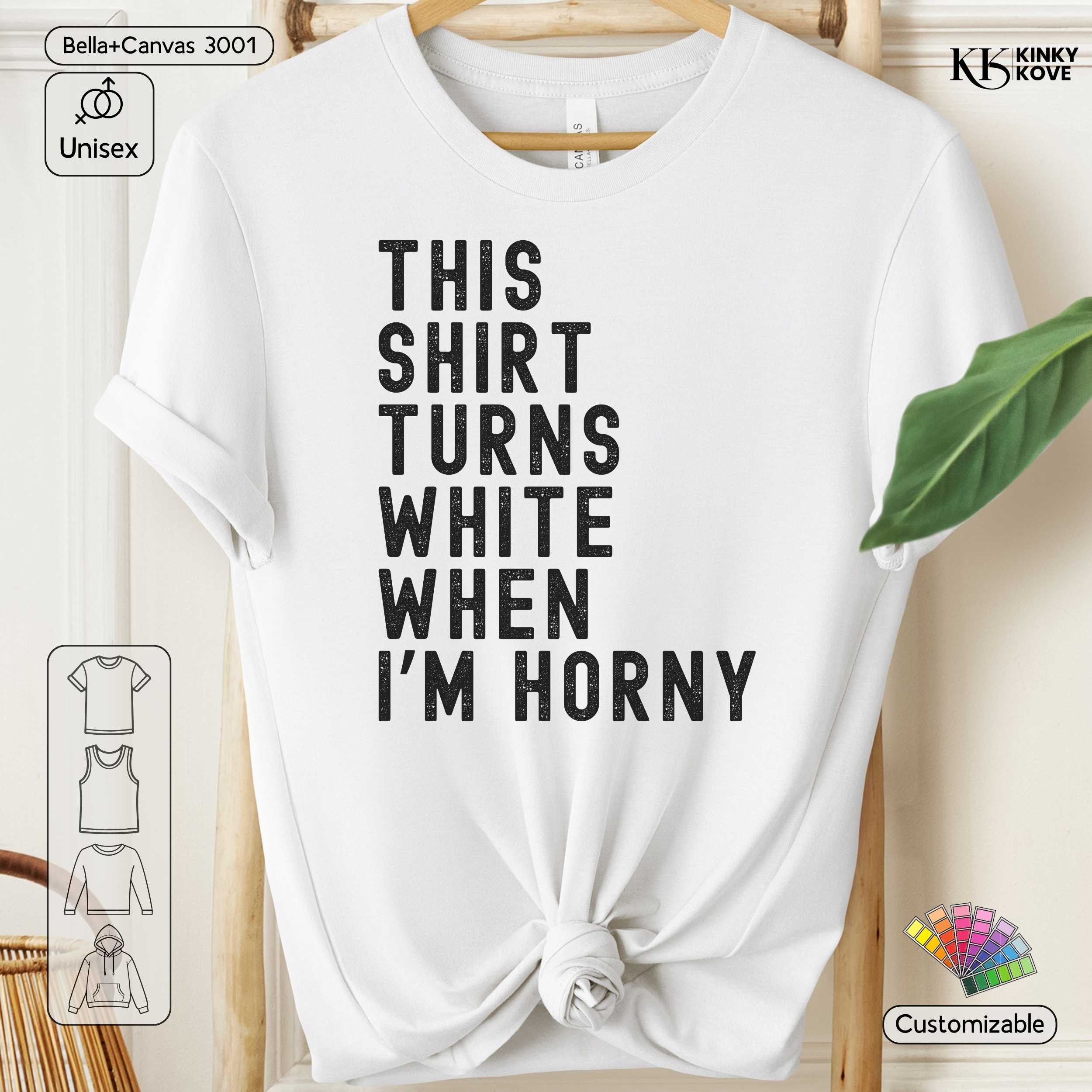 White t-shirt with text 'This shirt turns white when I'm horny' on a wooden hanger.
