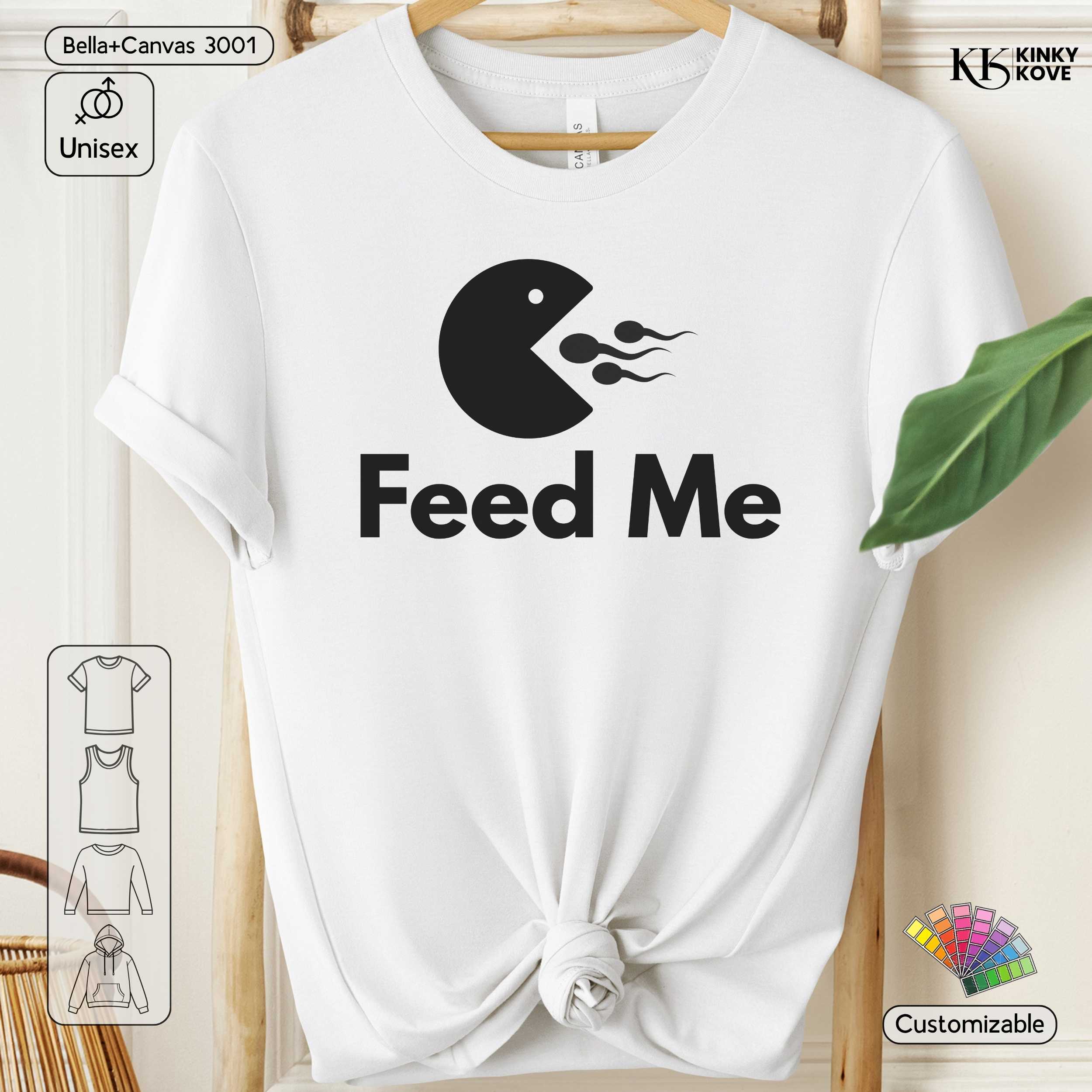 White t-shirt with 'Feed Me' graphic design on a wooden hanger.