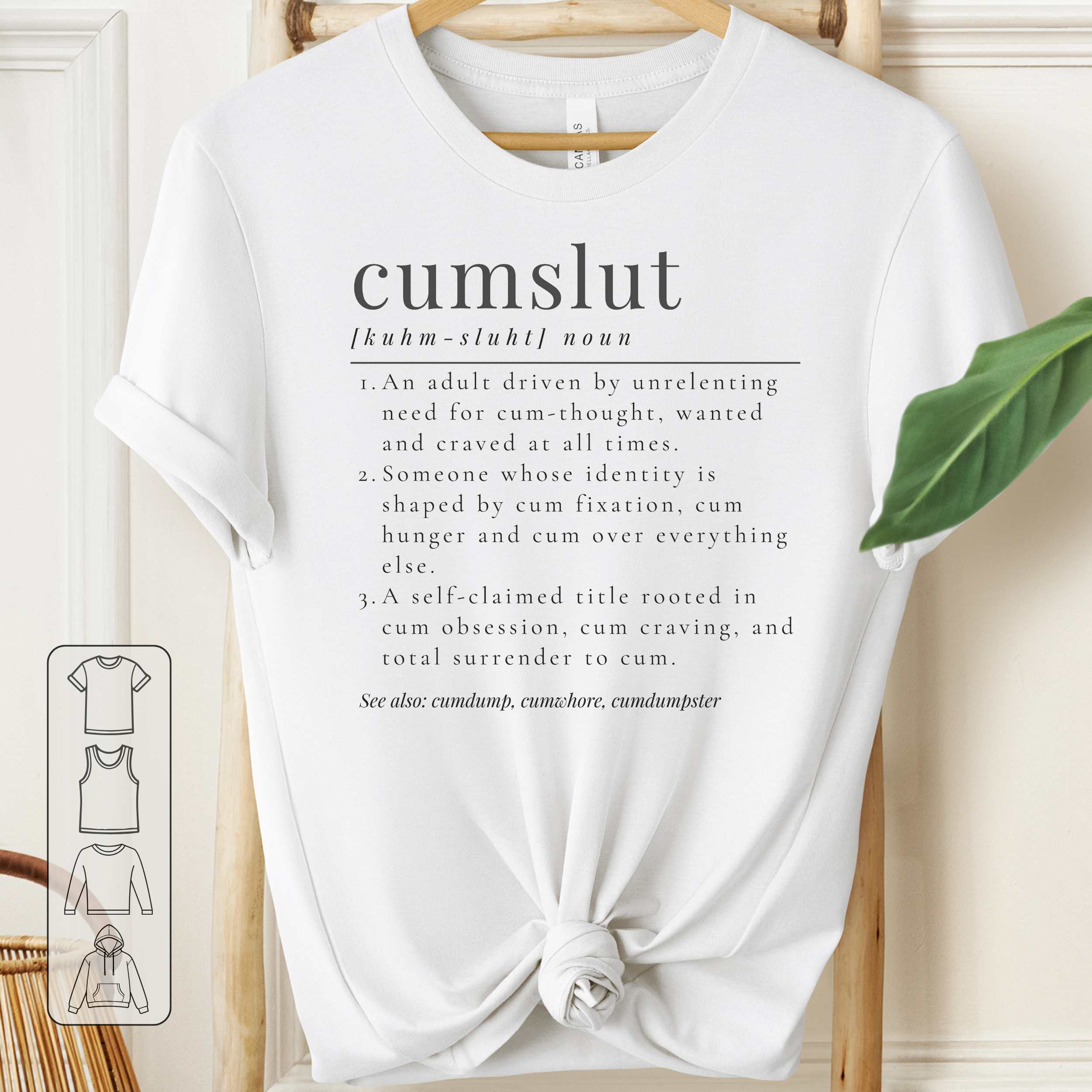 White t-shirt with 'cumslut' definition text on a wooden hanger.
