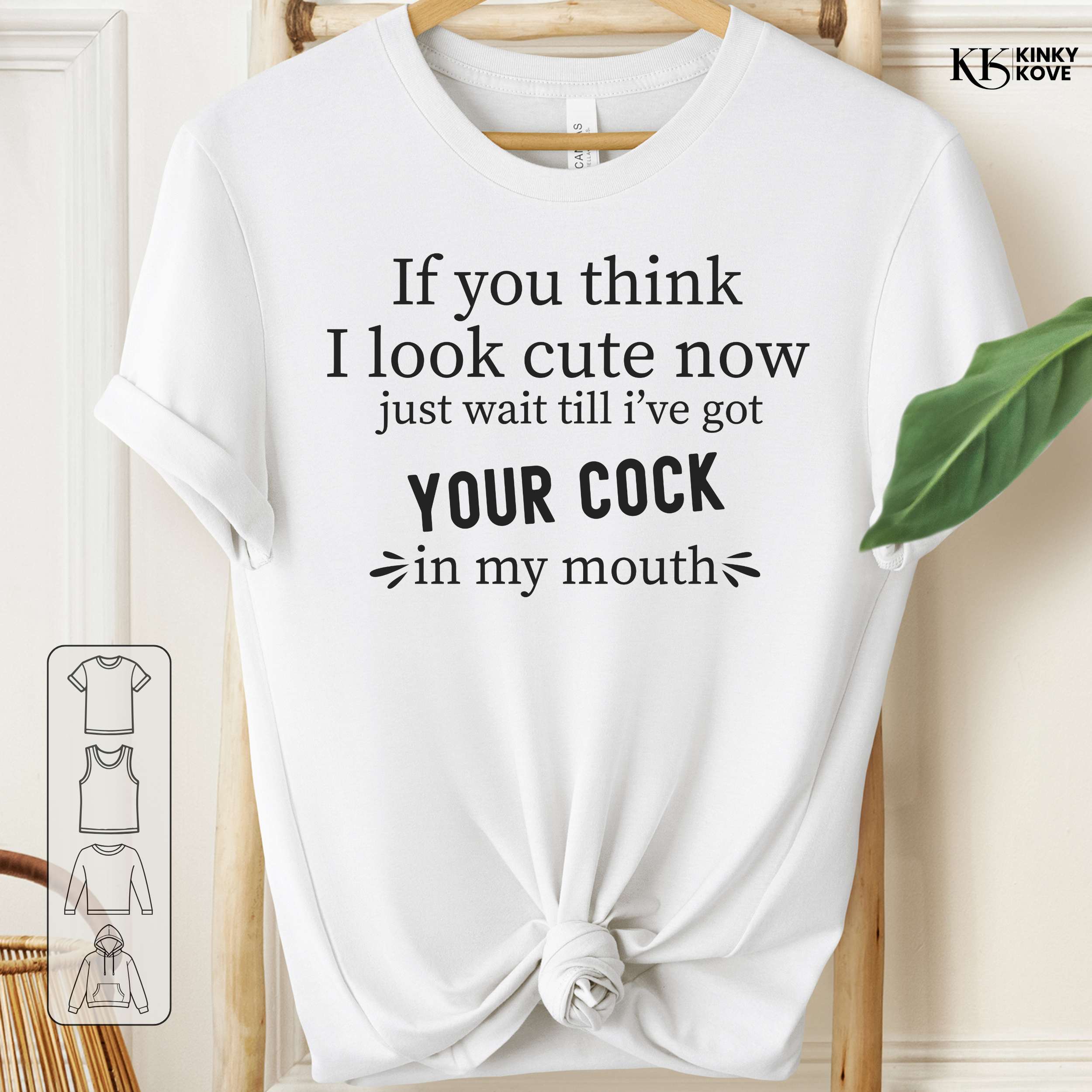 White t-shirt with black text on a wooden hanger against a white background