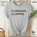 Gray t-shirt with 'her pleasure, my priority' text on a hanger with branding visible.
