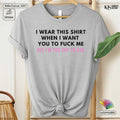 Gray t-shirt with a humorous text design on a hanger.