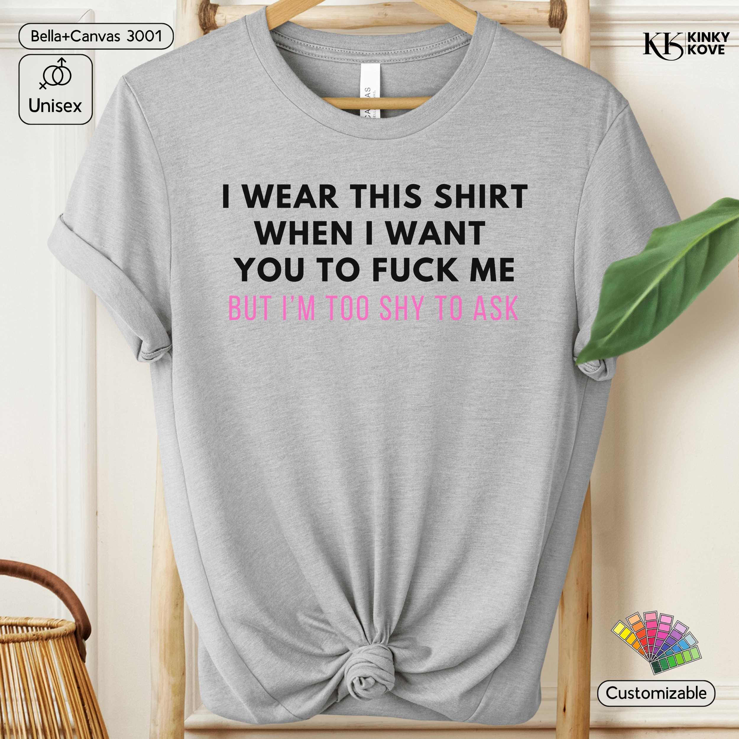 Gray t-shirt with a humorous text design on a hanger.
