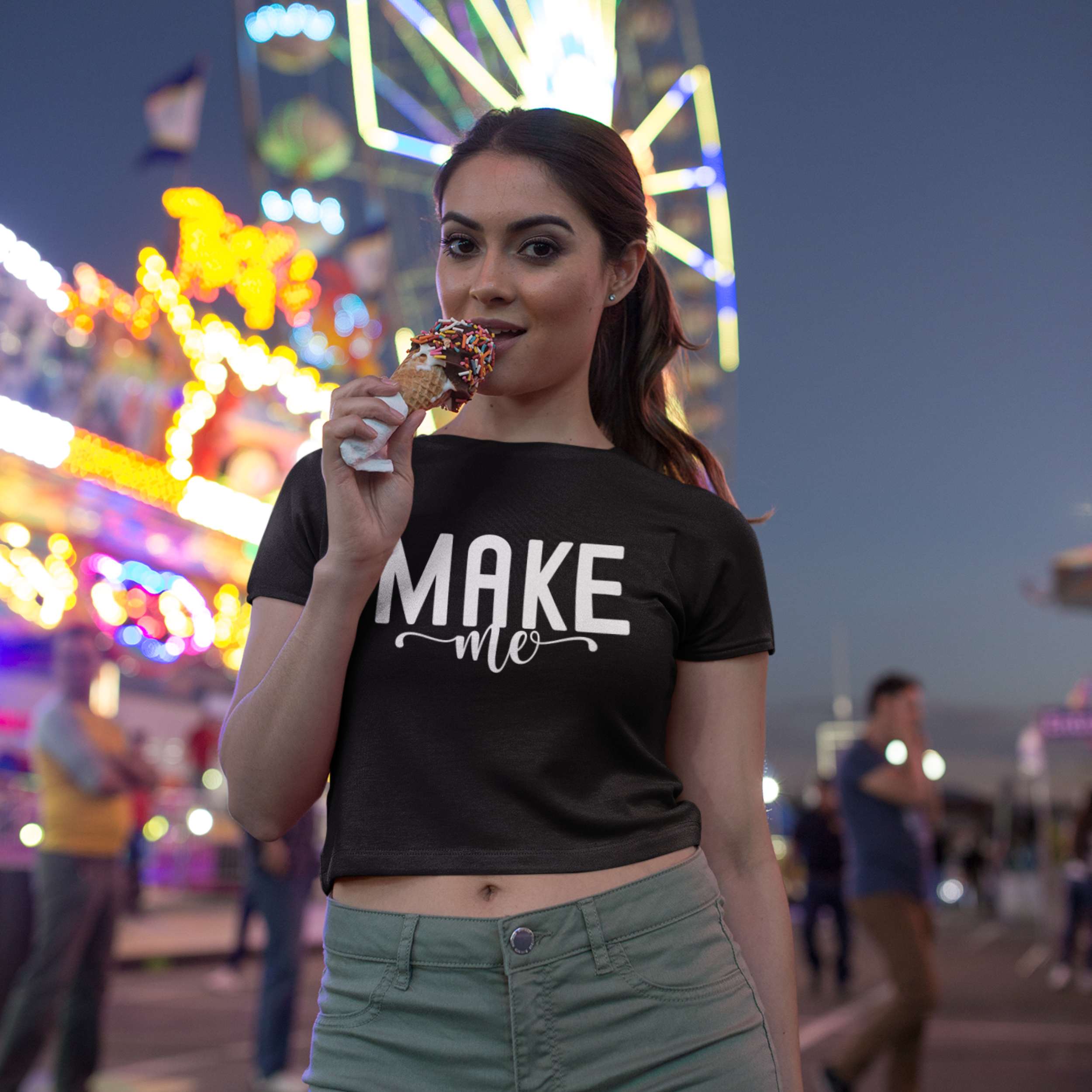 Woman eating a cotton candy at a carnival with a Ferris wheel in the background