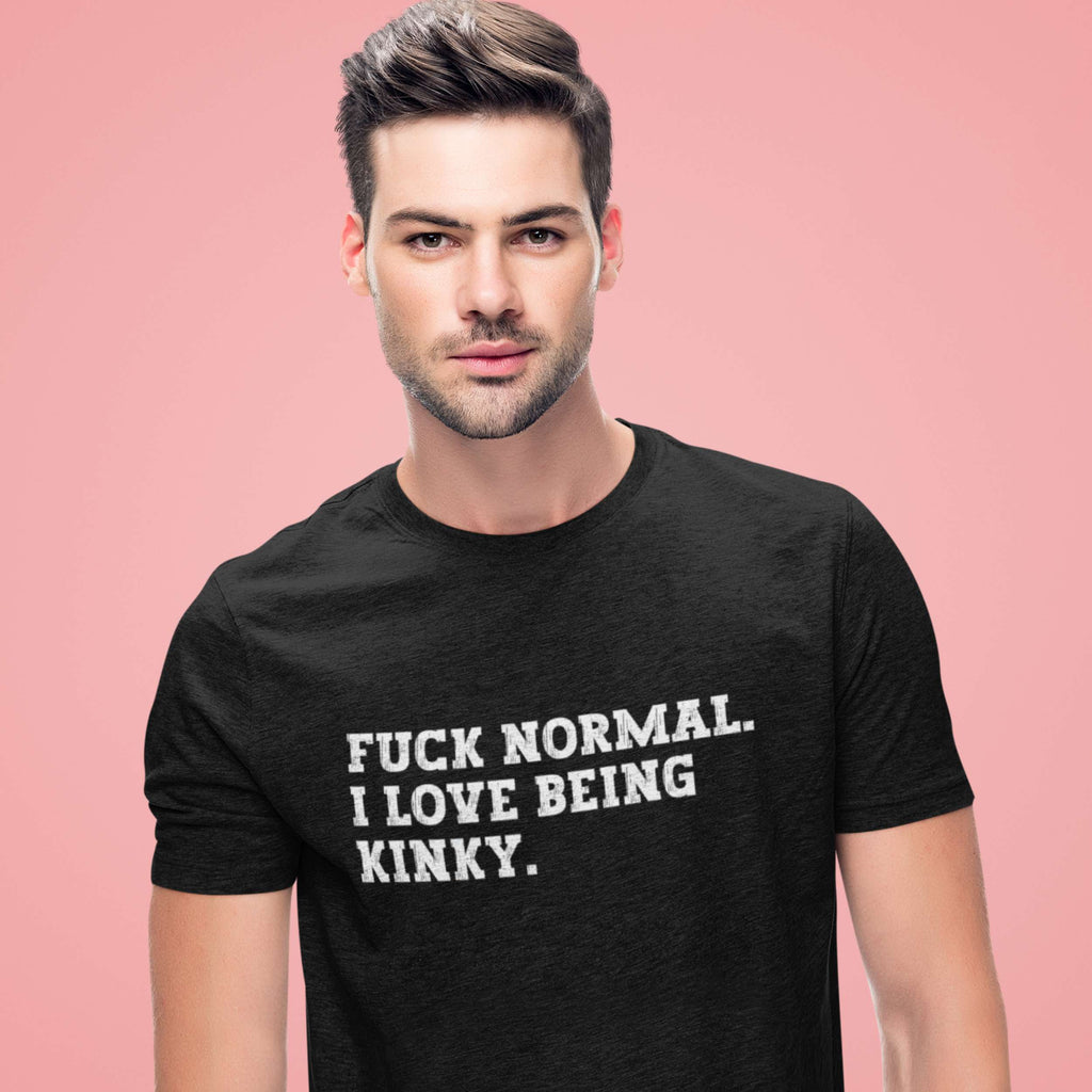 Man wearing a black t-shirt with text on a pink background