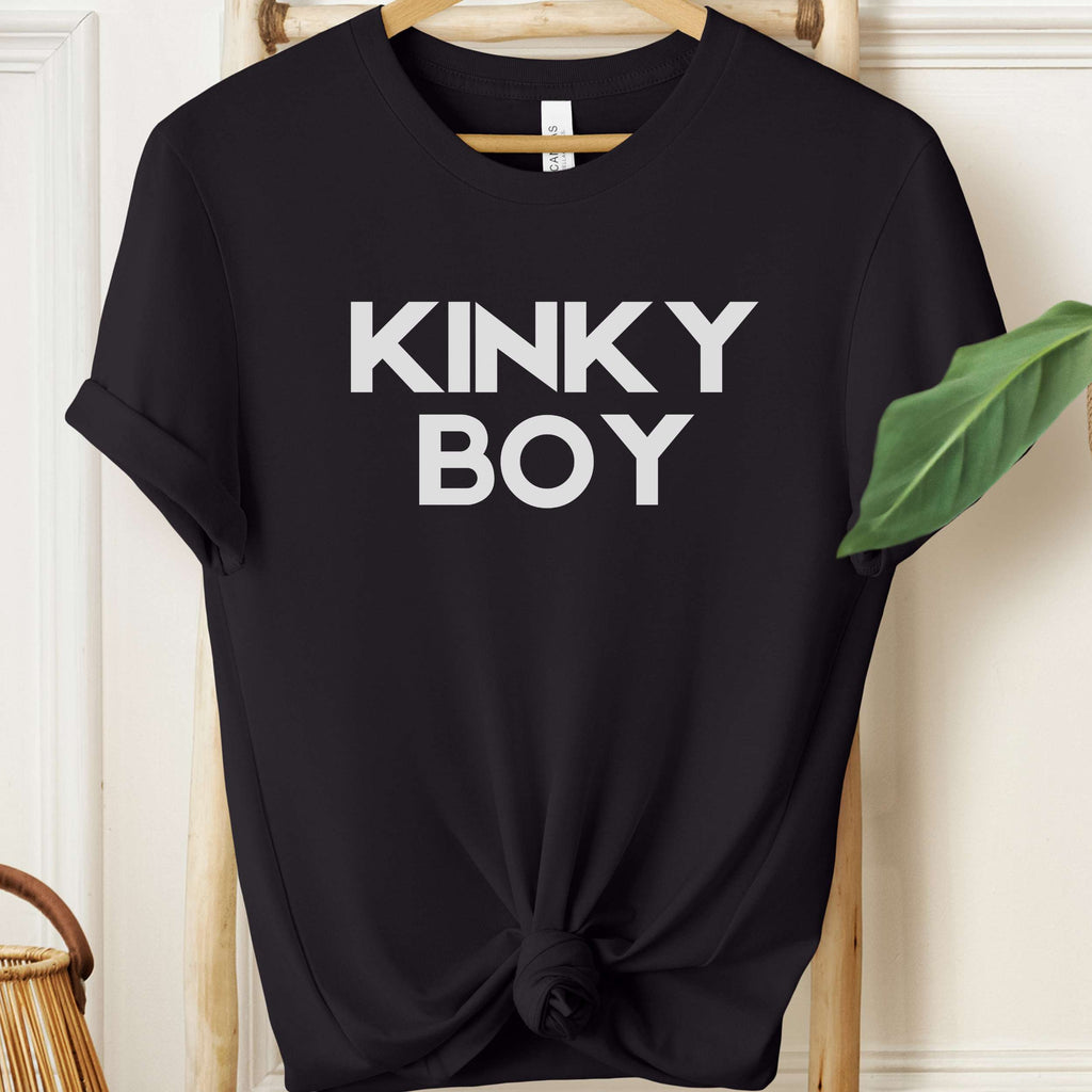 Black t-shirt with 'KINKY BOY' text on a hanger against a neutral background