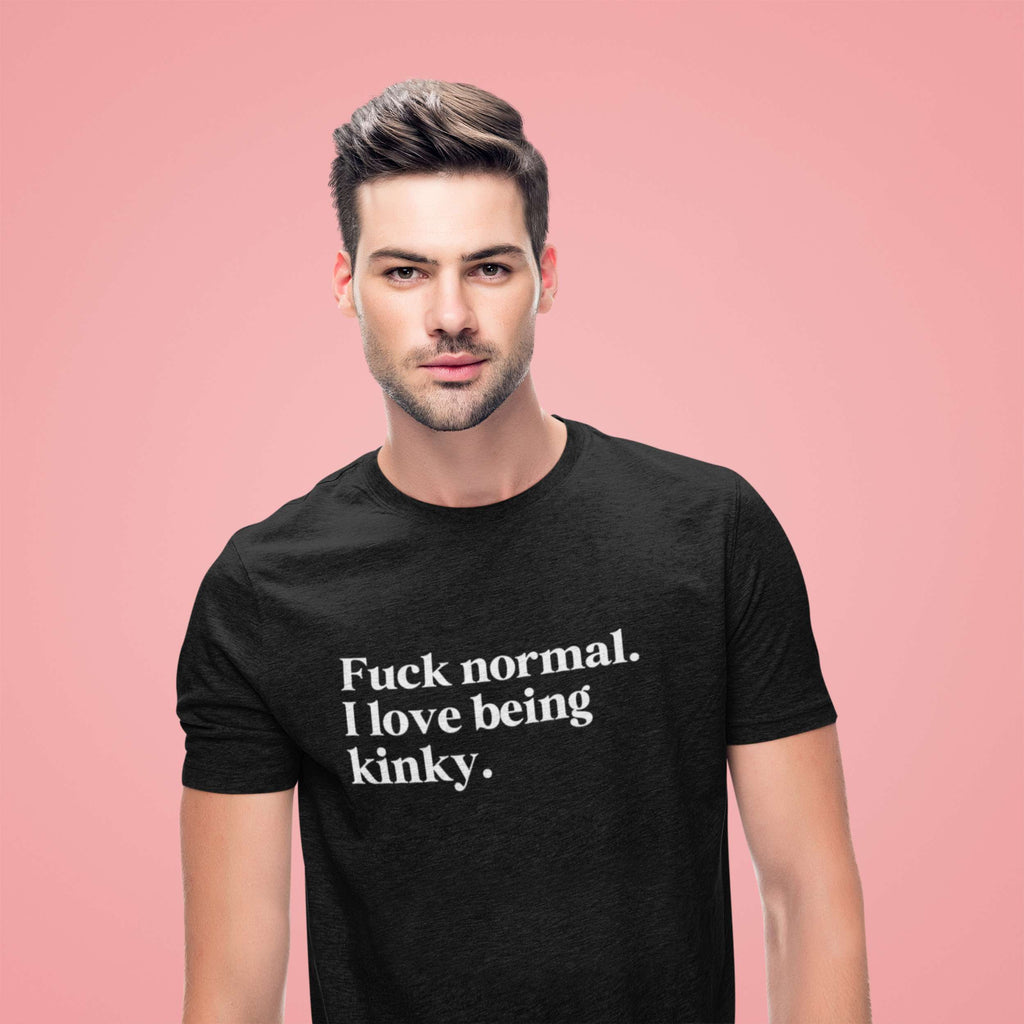 Man wearing a black t-shirt with text on a pink background