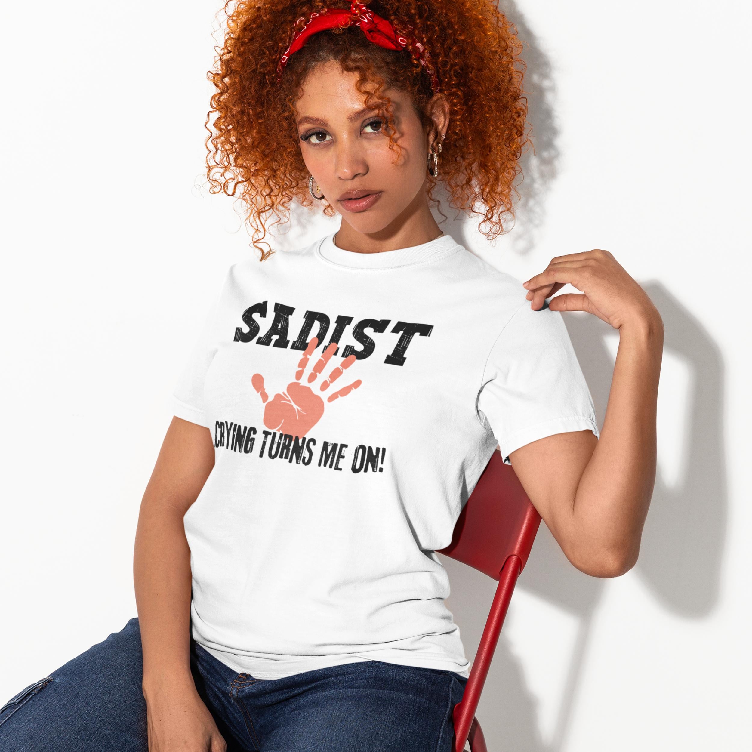 Model wearing white sadist shirt with bold adult humour slogan and handprint graphic
