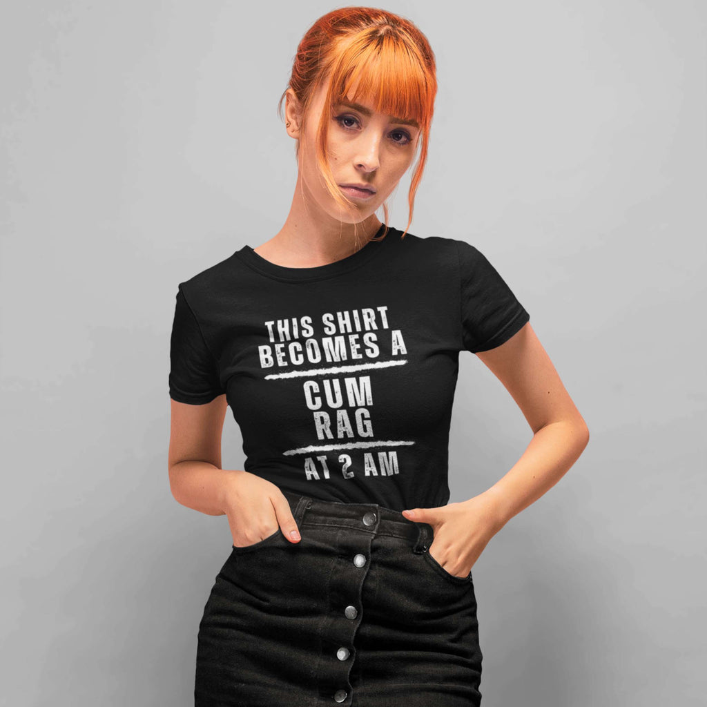 Person wearing a black t-shirt with humorous text design against a gray background
