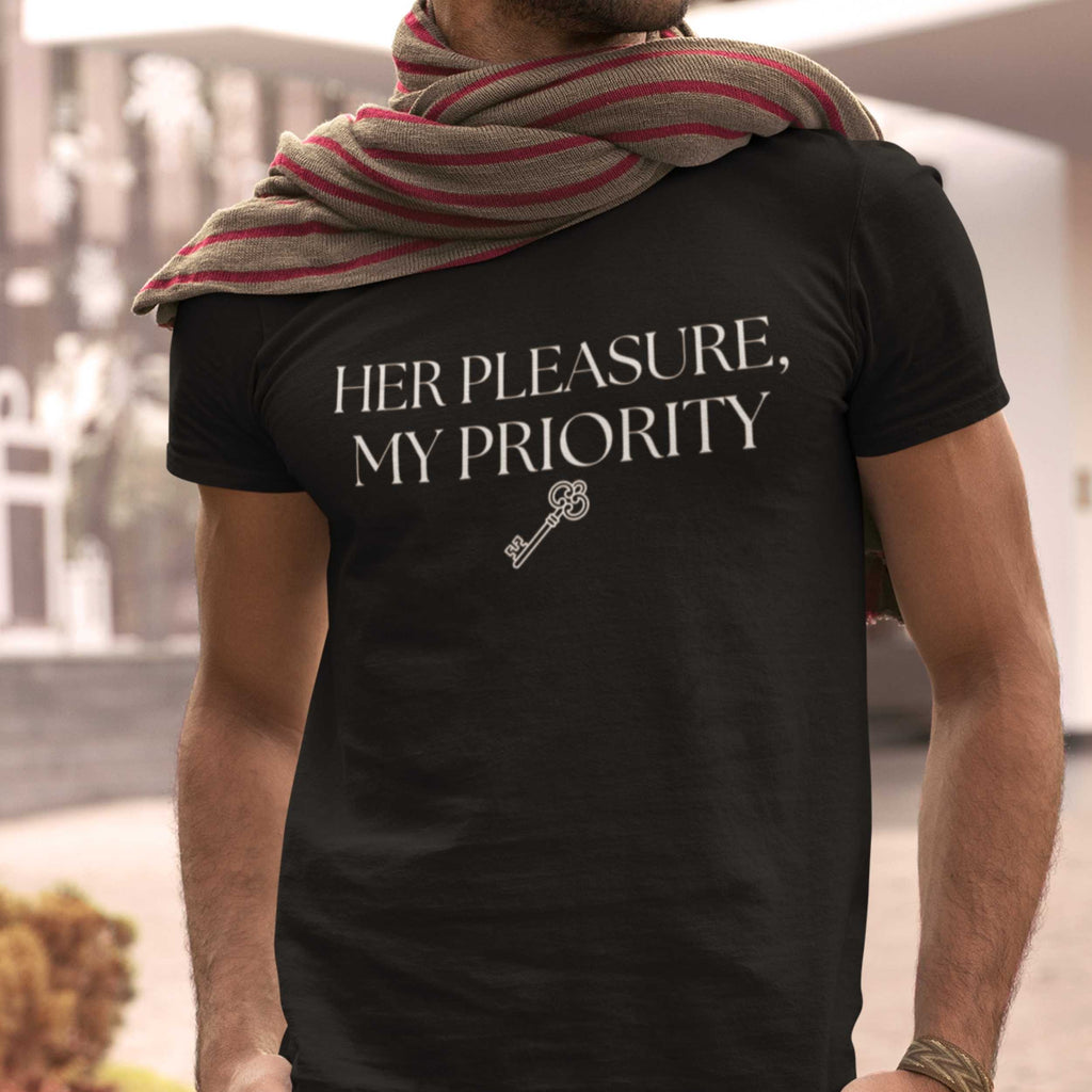 Person wearing a black t-shirt with 'Her Pleasure, My Priority' text and key graphic.